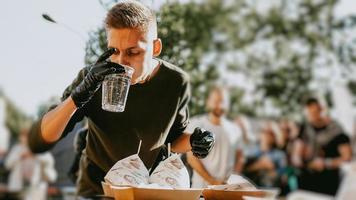 Man enjoing outdoor street food festival, Beer and Burger event photo