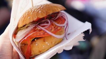 Beef burgers being served on food stall on open kitchen photo