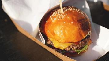 Beef burgers being served on food stall on open kitchen photo