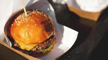 Beef burgers being served on food stall on open kitchen photo