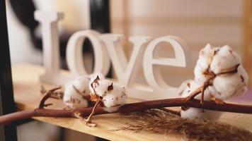Love wooden letters, vintage styled and cotton flower photo