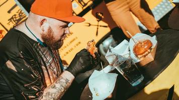 Man enjoing outdoor street food festival, Beer and Burger event photo