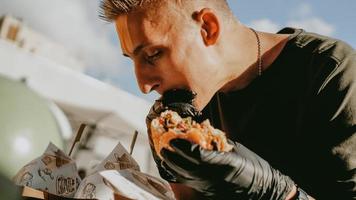 Man enjoing outdoor street food festival, Beer and Burger event photo