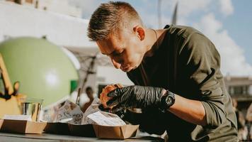 Man enjoing outdoor street food festival, Beer and Burger event photo