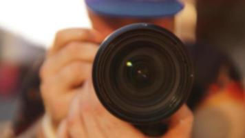 Blurred photo. Close-up of a man with a photographic lens photo