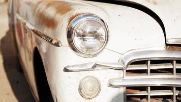 Retro car. Old vintage car. Headlight close up photo