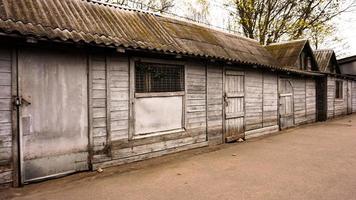Wooden rural buildings. Old sheds. Zoo storage rooms photo