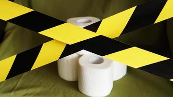 Stop panic - coronavirus. Toilet paper behind the tape photo