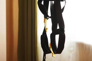 Closeup view of suspension training at home photo