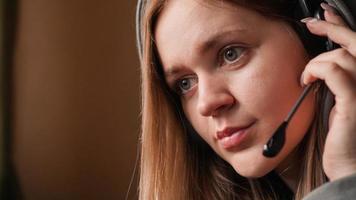 Portrait of a young girl in a hoodie and with a headset photo