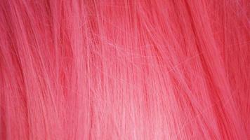 textura de primer plano de cabello rosado. puede usarse como fondo foto