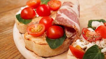 Italian appetizer. Bruschetta on a wooden board photo
