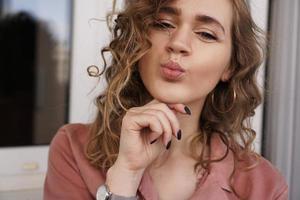 Beautiful funny pretty curly lady positive good mood photo