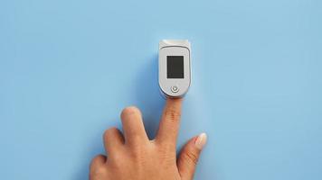 Medical device for hypoxia. Female finger in a pulse oximeter photo