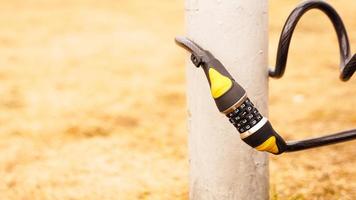 Combination lock near the post. Protection photo
