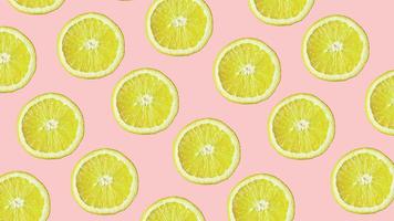 Top view of colorful fruit pattern of fresh lemon on pink background photo