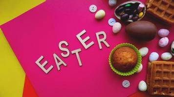 Decor Easter eggs on pink background. Flat lay photo