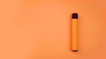 Orange disposable electronic cigarette on bright background photo