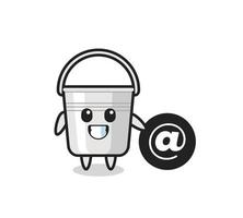 Cartoon Illustration of metal bucket standing beside the At symbol vector