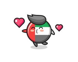 Dibujos animados de carácter de insignia de bandera de los Emiratos Árabes Unidos con gesto de besos vector