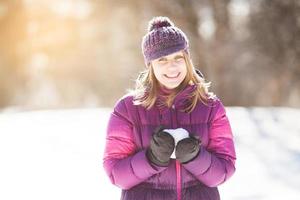 Happy young woman with snow photo