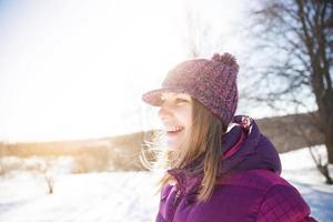 Happy smiling girl in knitted  hat photo