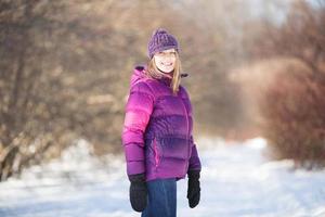 Happy girl in winter park photo