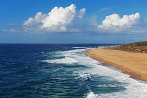 Landscape with ocean and cloudy blue sky photo