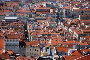 Top view of the city with a lot of houses with roofs photo