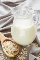Vegan oat milk, non dairy alternative milk photo