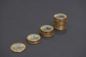 Stacks of golden and silver coins - 1 Real photo