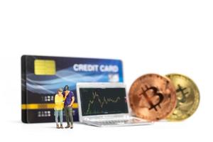 Couple looking at crypto currency chart on laptop background photo