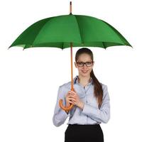 Happy girl standing under a umbrella photo