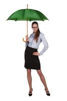 Beautiful woman standing under a big green umbrella photo