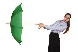 Girl pulls to itself open umbrella photo
