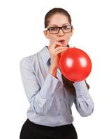 Girl inflating a red ball photo