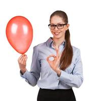 Girl with inflated balloon shows that all okay photo
