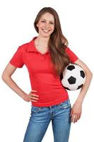 hermosa chica con un balón de fútbol foto