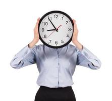 Woman in a shirt holds a round clock photo