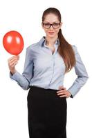 Business woman holding a balloon inflated