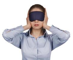 Girl blindfolded stopped up their ears photo