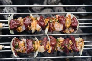 Surf and turf  grilled steak and seafood on a skewer