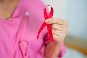 Breast cancer, pink ribbon at Asian senior lady patient photo