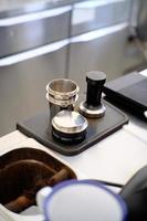 Coffee tamper view from a barista desk. Coffee concep photo