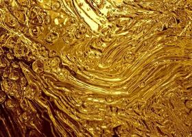 Smooth gold texture liquid background photo