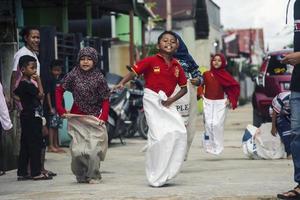 Sorong, Papua, Indonesia 2021- People celebrate Indonesia's independence day with various competitions photo