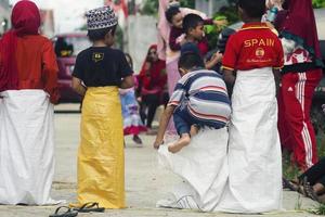 Sorong, Papua, Indonesia 2021- People celebrate Indonesia's independence day with various competitions photo