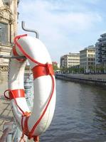 Lifebuoy on river side photo