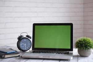 Laptop with blank screen on office desk photo