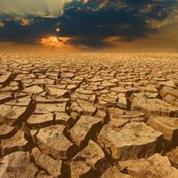 crack earth with beautiful sky at sunset photo